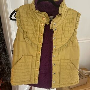 Vintage puffer vest with ruffles. Gold vest with purple fleece lining.